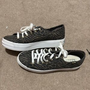 Keds Black Sneakers with White Accents and Textured Upper